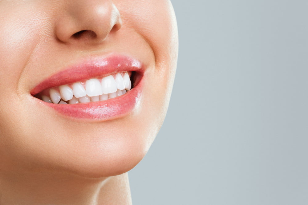 Services 1 perfect healthy teeth smile young woman teeth whitening stomatology concept Tijan Dental Center
